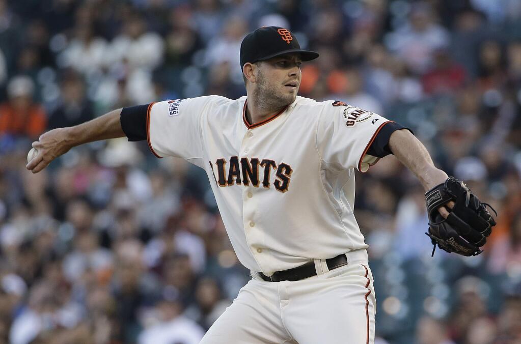 San Francisco Giants pitcher Chris Heston throws against the Milwaukee Brewers during the first inning of a baseball game in San Francisco, Monday, July 27, 2015. (AP Photo/Jeff Chiu)