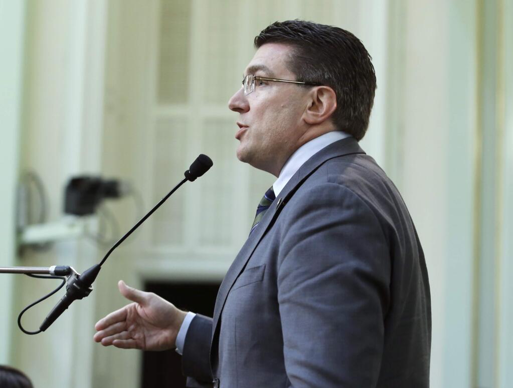 Assemblyman Jay Obernolte, R-Big Bear Lake, urges lawmakers to reject a measure to raise fees on phones to pay for an upgrade to the 911 system during the Assembly session in Sacramento, Calif., Monday, June 17, 2019. The Assembly approved the bill, SB96. (AP Photo/Rich Pedroncelli)