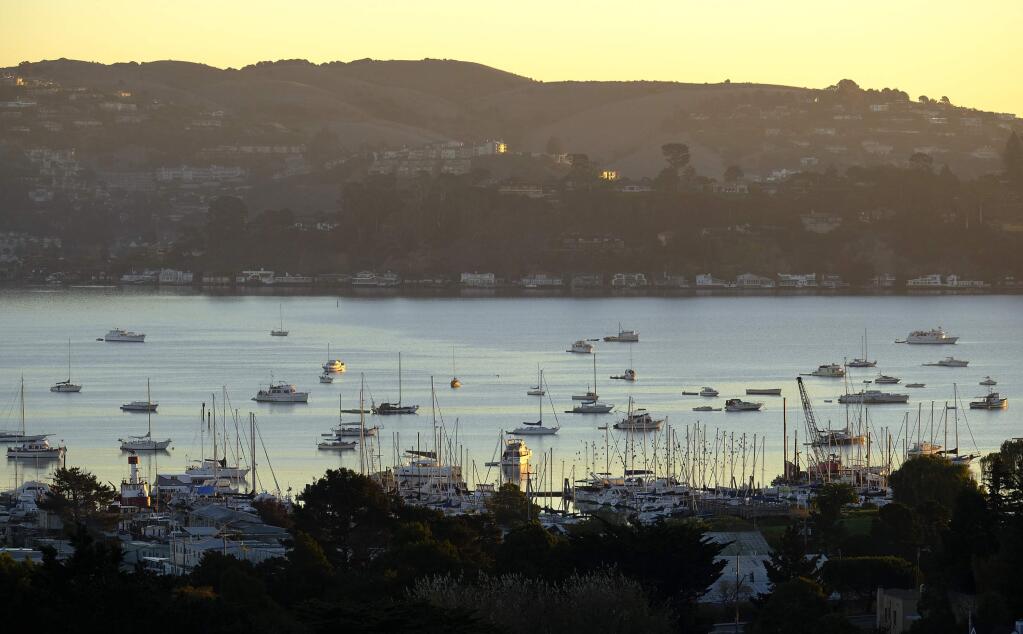 Numerous boats are anchored in Richardson Bay, Monday, Nov. 5, 2018, in Sausalito, Calif. Authorities are cracking down on small boats squatting off Sausalito, where the number of vessels that sit motionless away from shore has doubled over the last year amid a housing crisis in the San Francisco Bay Area. (AP Photo/Eric Risberg)