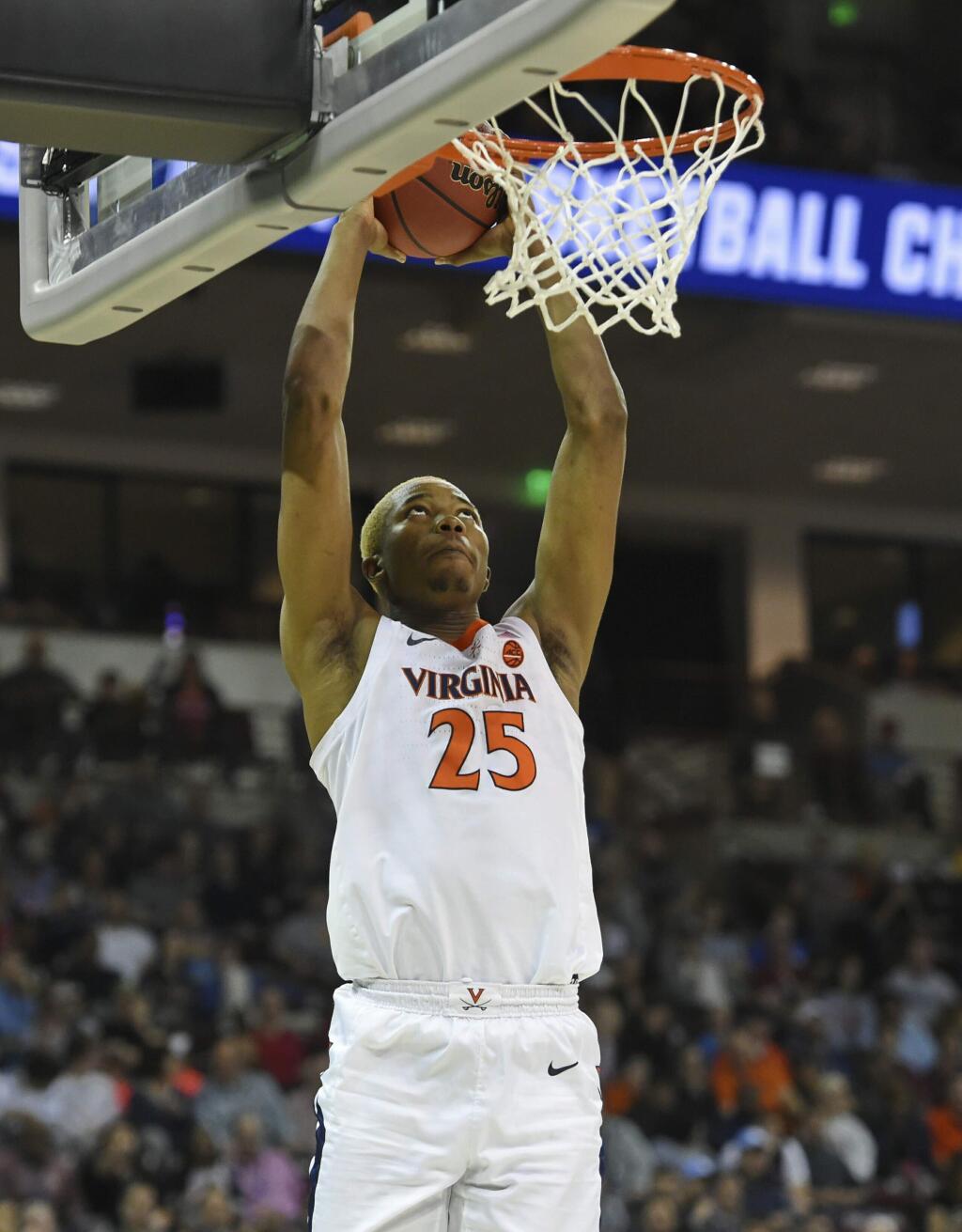 Virginia's Mamadi Diakite makes a dunk against Gardner-Webb during a first-round game in the NCAA Tournament in Columbia, S.C., Friday, March 22, 2019. (AP Photo/Richard Shiro)