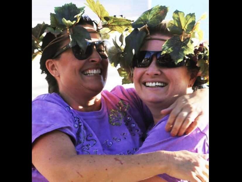 Grape-stomping sisters Dee Dee Lombardi Brandt, left, and Angela Lombardi Carvalho.(COURTESY PHOTO)