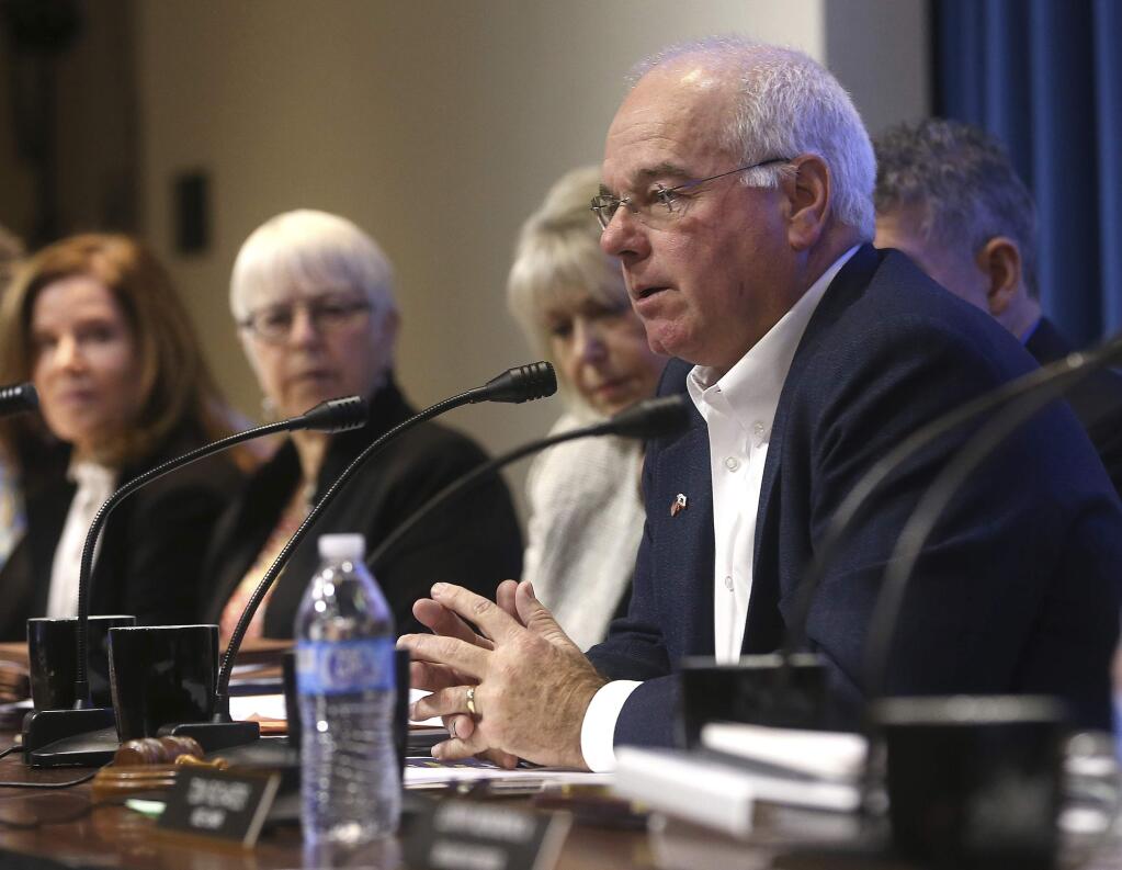 Lenny Mendonca, right, was elected chairman of The California High-Speed Rail Authority's board of directors, during a board meeting Tuesday, Feb. 19, 2019, in Sacramento, Calif. (AP Photo/Rich Pedroncelli)