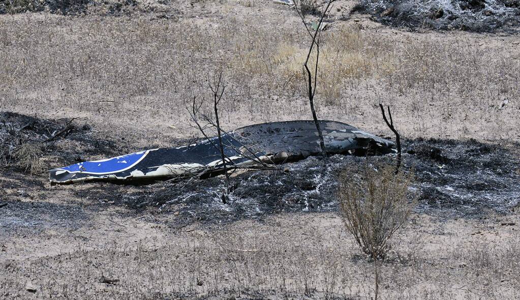 Scattered debris remains on the ground following a plane crash near the town of Ventucopa, Calif., Monday, June 22, 2015. County fire spokesman Mike Lindbery says the crash happened around 9:30 a.m. Monday near Quatal Canyon in Los Padres National Forest. (Mike Eliason/Santa Barbara County Fire Department via AP)