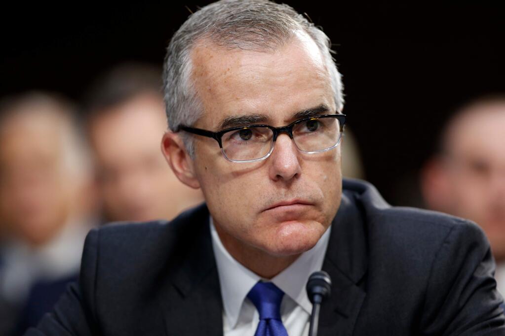 FILE - In this June 7, 2017, file photo, then-FBI acting director Andrew McCabe listens during a Senate Intelligence Committee hearing about the Foreign Intelligence Surveillance Act, on Capitol Hill in Washington. The Justice Department's inspector general has sent a criminal referral about McCabe to federal prosecutors in Washington. A person familiar with the matter says the referral was sent to the U.S. Attorney's office for the District of Columbia. It does not mean that McCabe will be charged. (AP Photo/Alex Brandon, File)