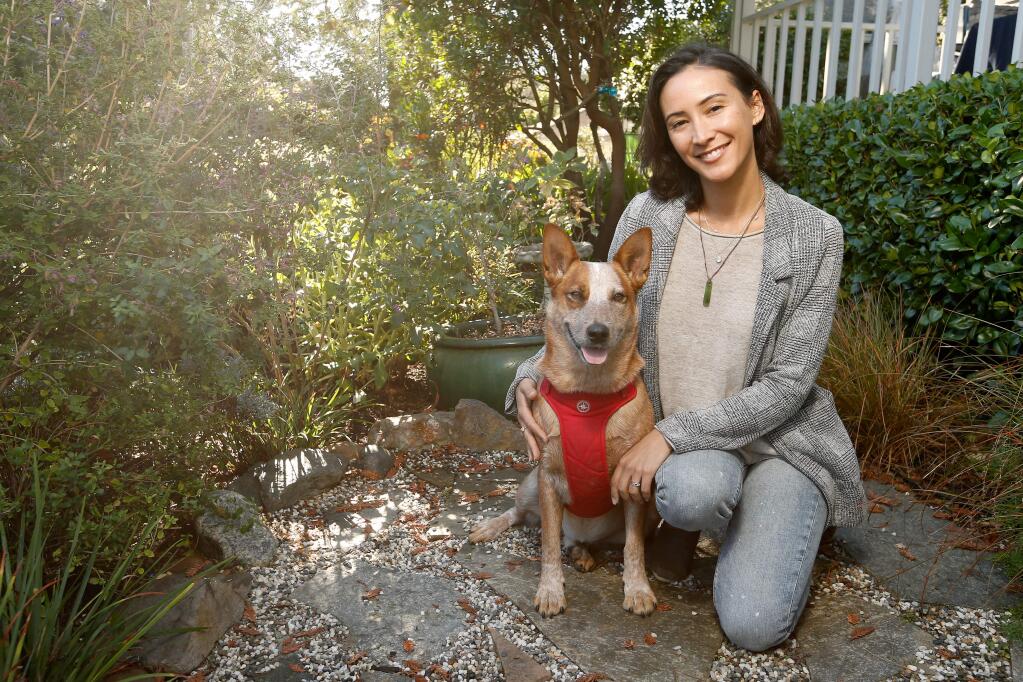 Veterinarian and animal rights activist Dr. Heather Rally poses for a portrait with her dog Goose at their home in Sebastopol, California, on Saturday, November 3, 2018. (Alvin Jornada / The Press Democrat)