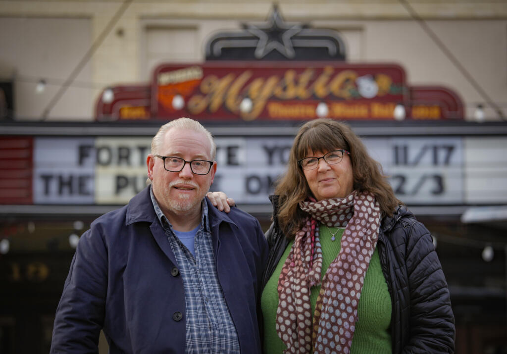 Dave and Juliet Pokorny stand outside the Mystic Theatre in downtown Petaluma on Tuesday, Nov. 16, 2021. They will be reviving the annual West Side Stories Grand Slam competition at the Mystic in December. (CRISSY PASCUAL/ARGUS-COURIER STAFF)