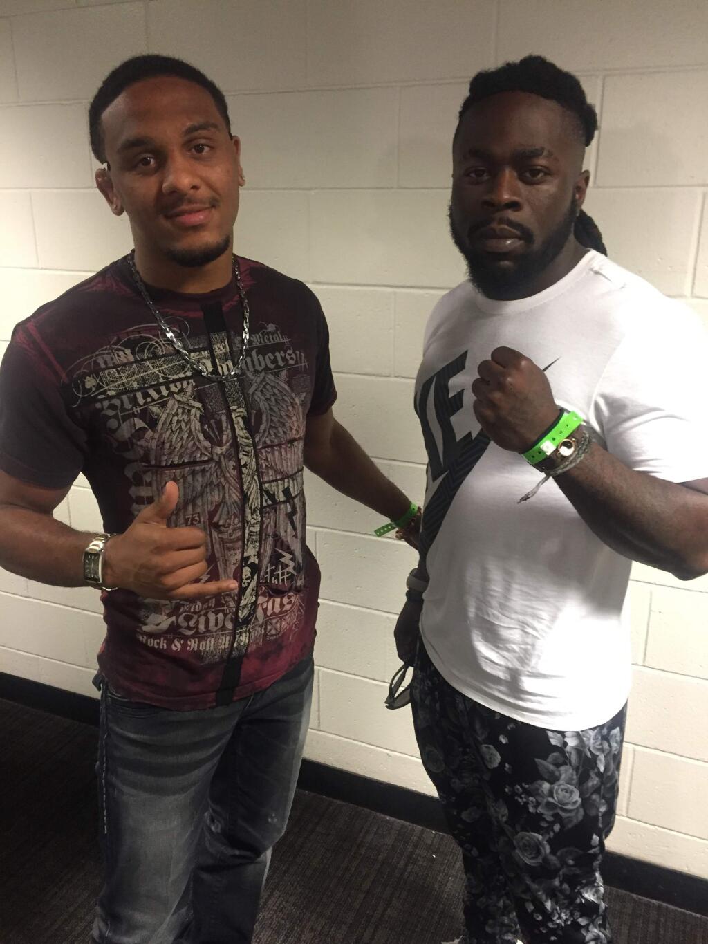 In this May 14, 2016, photo provided by Bellator MMA, mixed martial artist Kevin Ferguson Jr., right, poses for a photo with fellow fighter A.J. McKee after attending a Bellator fight card in San Jose, Calif. Ferguson, the oldest son of late fighting icon Kimbo Slice, will make his professional mixed martial arts debut next month for the Bellator promotion, The Associated Press learned Monday, July 25, 2016. (Bellator MMA via AP)