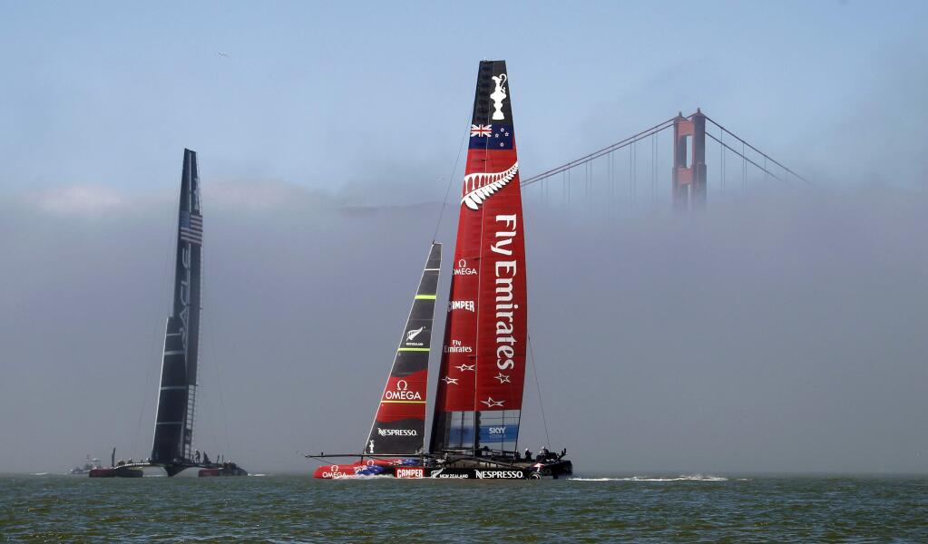 FILE - In this Sept. 22, 2013 file photo, Emirates Team New Zealand maneuvers with Oracle Team USA, left, before the 14th race of the America's Cup sailing event in San Francisco. (AP Photo/George Nikitin, File)