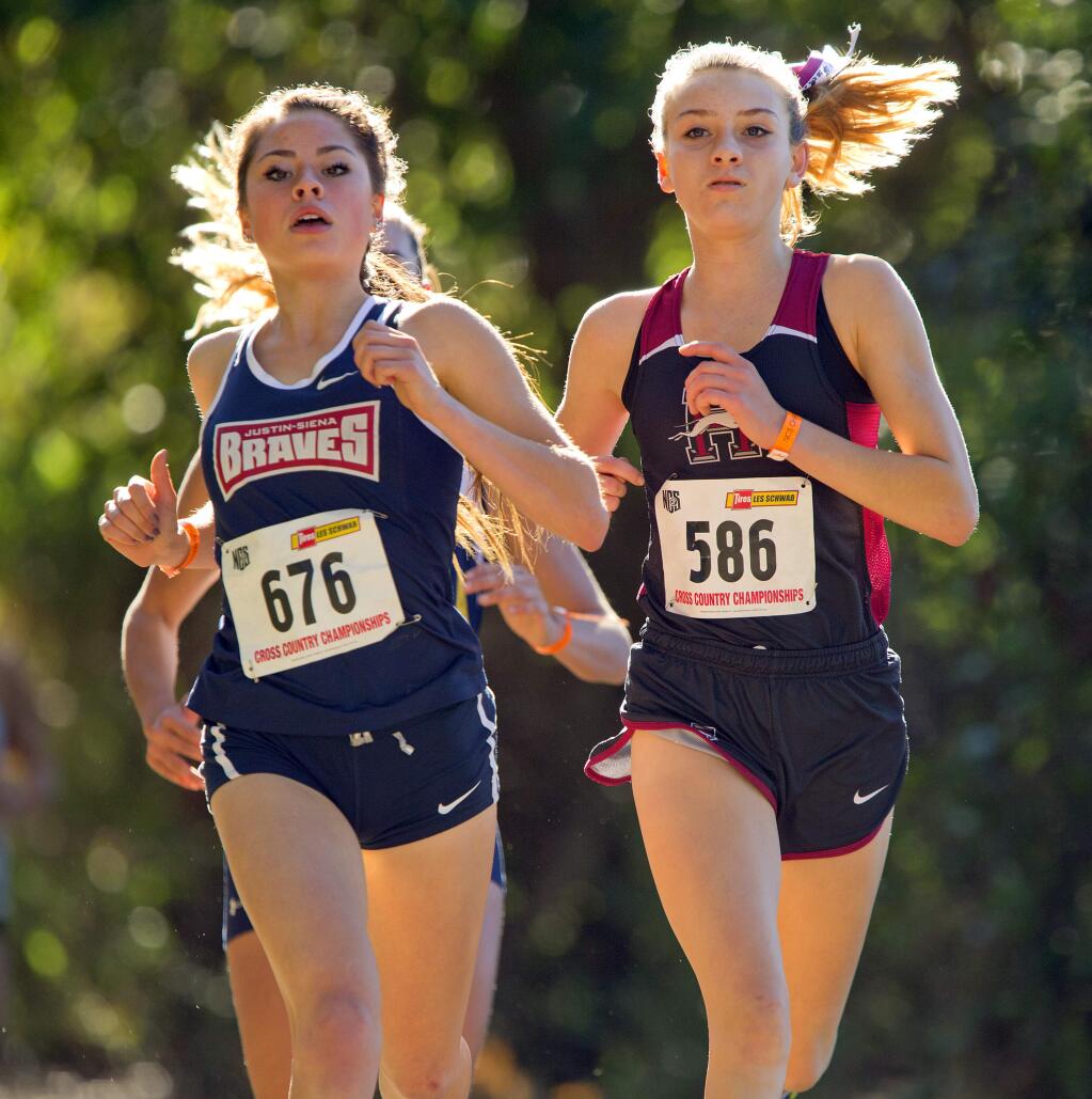 Healdsburg's Gabby Peterson, right, won the Div. 4 girls North Coast Section cross country championship by 16 seconds in Hayward on Saturday. (photo by John Burgess/The Press Democrat)
