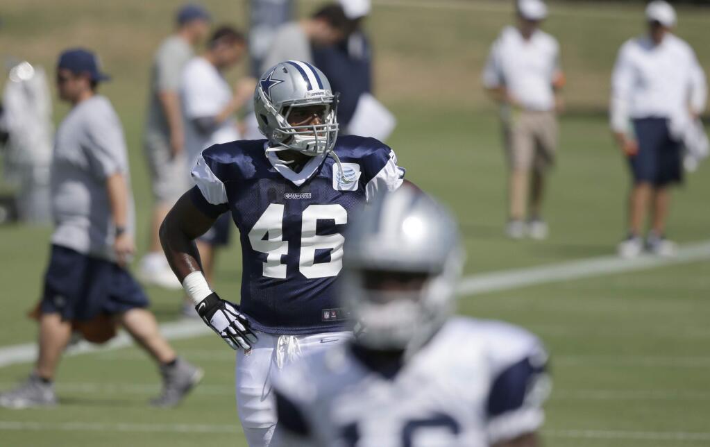 Dallas Cowboys practice squad player defensive end Michael Sam (46) looks around the field during team practice Wednesday, Sept. 3, 2014, in Irving, Texas. (AP Photo/LM Otero)