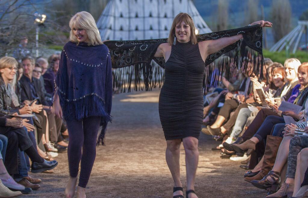 Former Sonoma Valley Mentoring Alliance executive director, Kathy Witkowicki (left), and the current ED, Lee Morgan Brown, did their own runway strutting to wild applause from attendees. Nomad Chic sponsored a fashion show last Thursday at Cornerstone. The store's owner, Linda Hamilton, organized the event as a fundraiser for the Sonoma Valley Mentoring Alliance. (Photos by Robbi Pengelly/Index-Tribune)