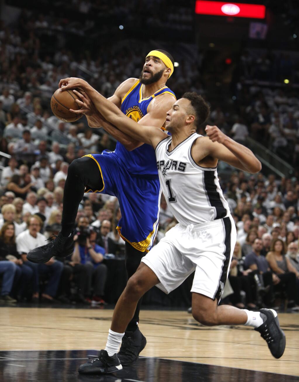 San Antonio Spurs guard Kyle Anderson(1) knocks the ball from a driving Golden State Warriors center JaVale McGee (1) during the first half of Game 3 of of the Western Conference finals on Saturday, May 20, 2017, in San Antonio. (AP Photo/Ronald Cortes)