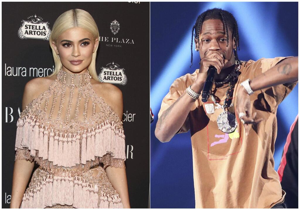 In this combination photo, TV personality Kylie Jenner, left, attends Harper's Bazaar Icons celebration on Sept. 9, 2016, in New York and rapper Travis Scott performs at the 2017 iHeartRadio Music Festival on Sept. 23, 2017, in Las Vegas. In an Instagram post Sunday, Feb. 4, Jenner announced the birth of her baby girl born Thursday. It's the first child for the 20-year-old reality star and the 25-year-old rapper. Jenner and Travis Scott said Tuesday their baby girl is named Stormi. (Photos by Andy Kropa, left, and John Salangsang/Invision/AP)