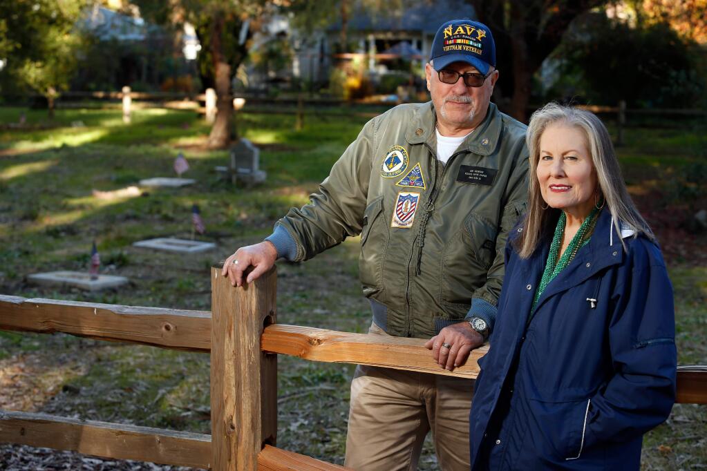 Sandy Frary, right, and Gary Greenough pose for a portrait at the County of Sonoma Cemetery in Santa Rosa, California, on Saturday, December 1, 2018. (Alvin Jornada / The Press Democrat)