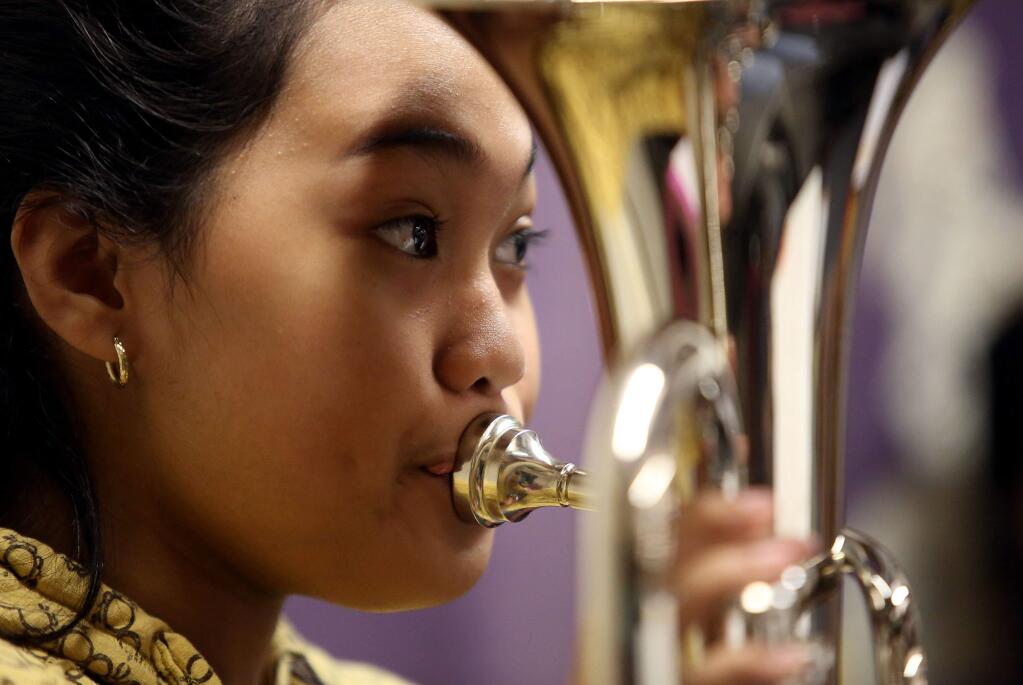 Marielle Salcedo plays the baritone during Comstock Middle School's band class, Monday, September 8, 2014. (Crista Jeremiason / The Press Democrat)
