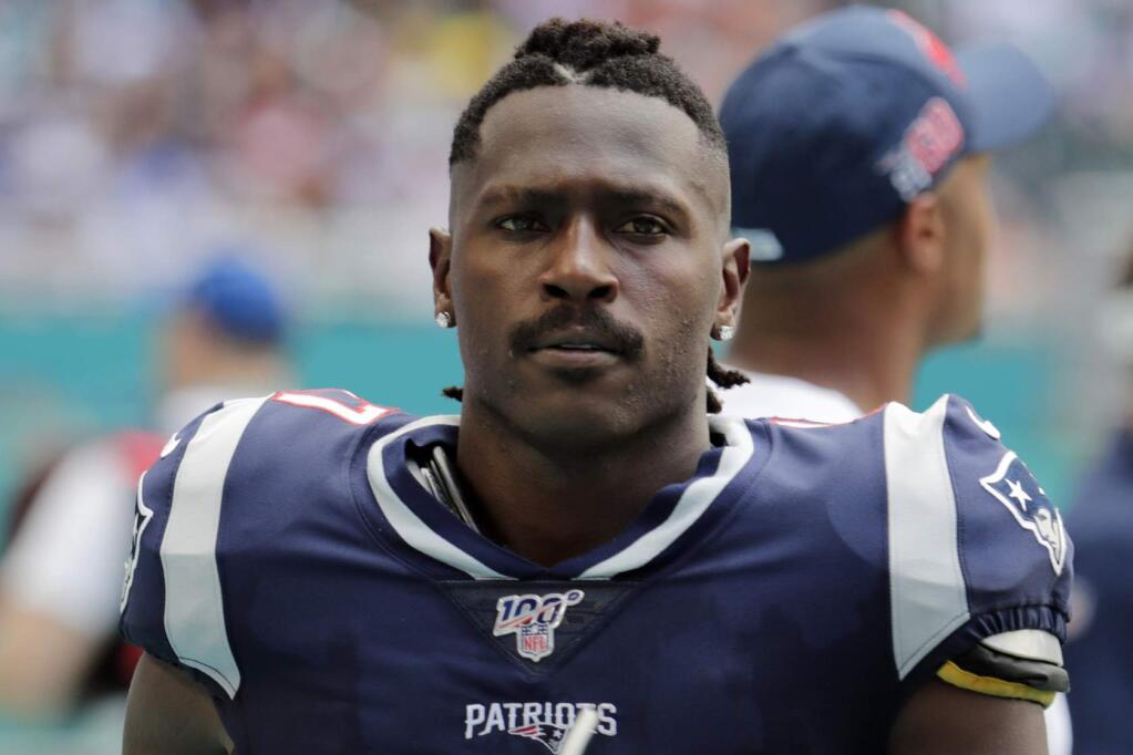 In this Sunday, Sept. 15, 2019, file photo, New England Patriots wide receiver Antonio Brown on the sideline during the first half against the Miami Dolphins in Miami Gardens, Fla. The Patriots released Brown on Friday, Sept. 20, 2019. (AP Photo/Lynne Sladky, File)