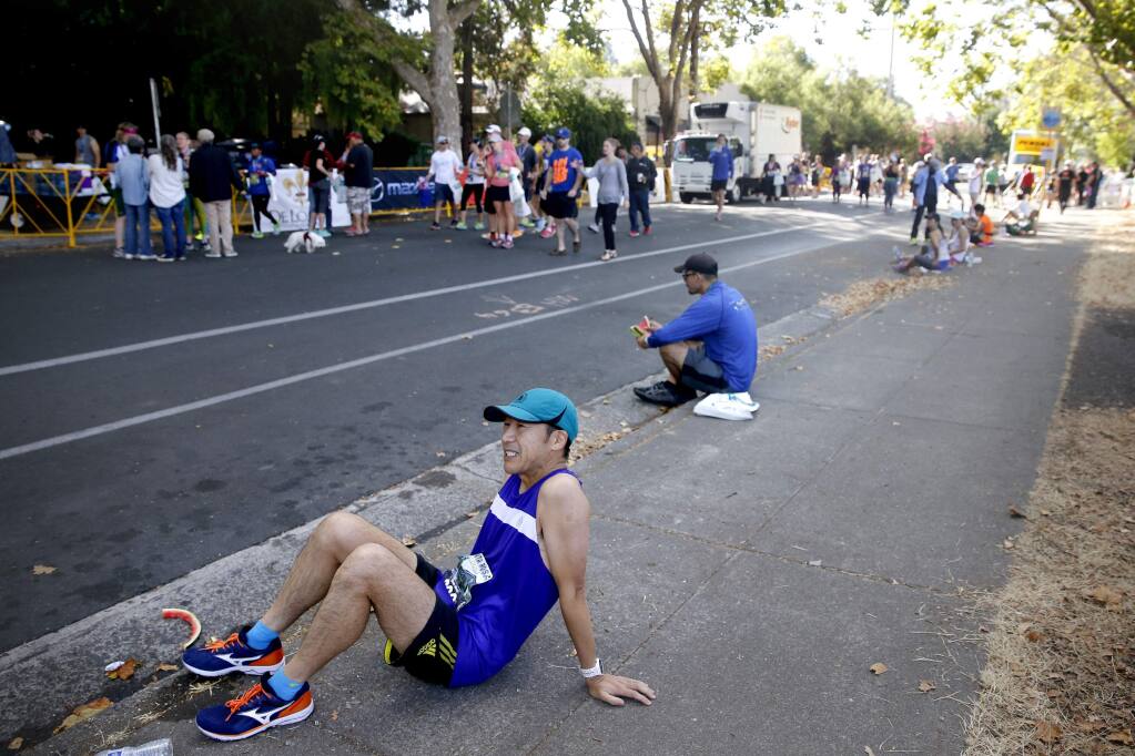 Toshiyuki Nagata, who has run in the Boston Marathon for the past 3 years, was disappointed after he failed to qualify for the Boston Marathon by 1 minute because of an .9-mile accidental detour. Photo taken at the finish of the Santa Rosa Marathon at Juilliard Park on Sunday, Aug. 28, 2016 in Santa Rosa. (BETH SCHLANKER / The Press Democrat)