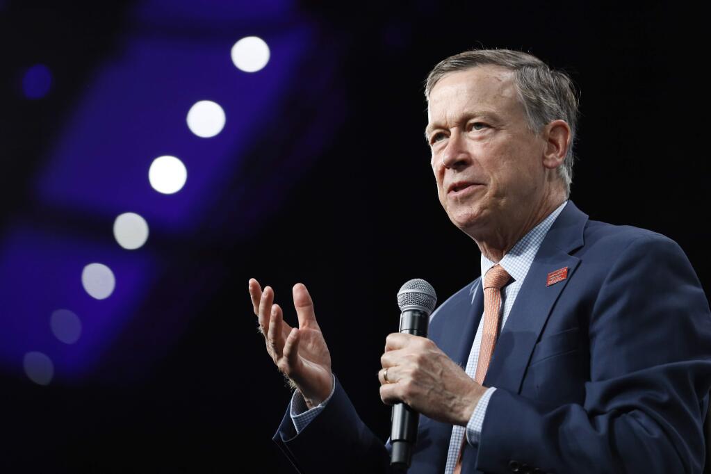 FILE - In this Aug. 10, 2019, file photo, then Democratic presidential candidate former Colorado Gov. John Hickenlooper speaks at the Presidential Gun Sense Forum, in Des Moines, Iowa. Former Colorado Gov. Hickenlooper said Thursday, Aug. 22, that he will run for the U.S. Senate, becoming the immediate front-runner in a crowded Democratic field vying for the right to challenge Republican incumbent Cory Gardner.(AP Photo/Charlie Neibergall, File)