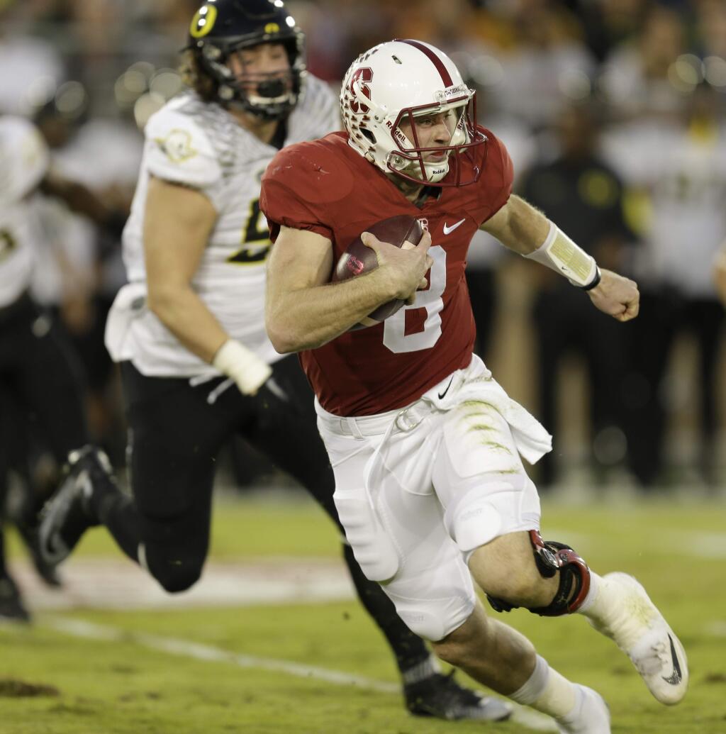 Stanford's Kevin Hogan rushes against Oregon during the first quarter Saturday, Nov. 14, 2015, in Stanford. (AP Photo/Ben Margot)