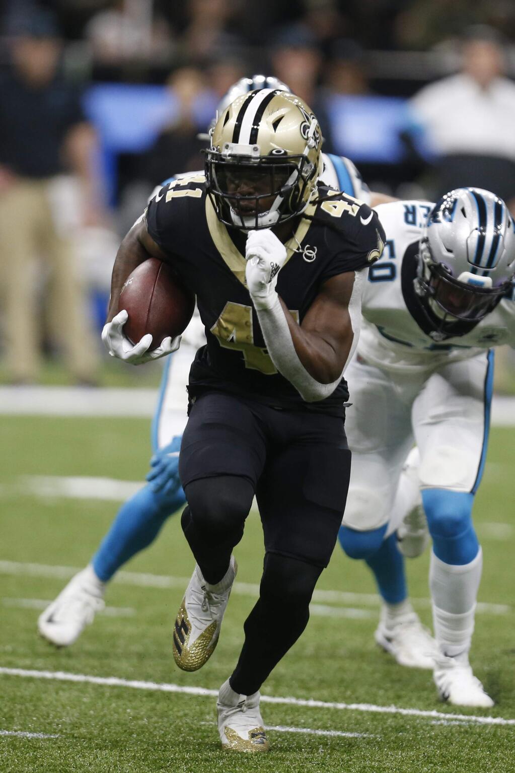 New Orleans Saints running back Alvin Kamara (41) runs the football, during the second half at an NFL football game against the Carolina Panthers, Sunday, Nov. 24, 2019, in New Orleans. (AP Photo/Butch Dill)