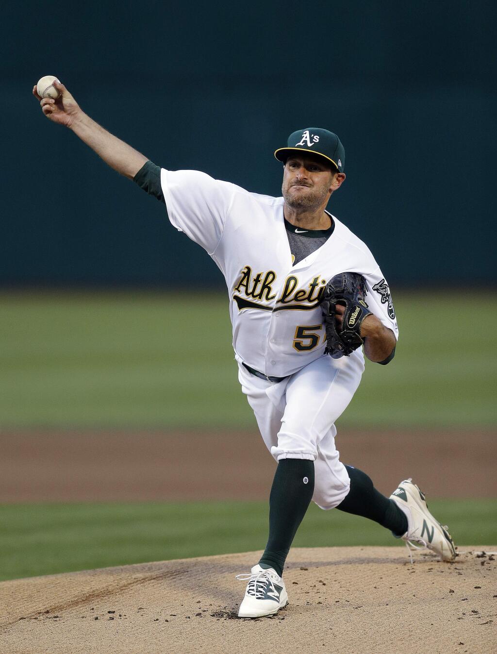 Oakland Athletics pitcher Chris Smith works against the Tampa Bay Rays during the first inning of a baseball game Tuesday, July 18, 2017, in Oakland, Calif. (AP Photo/Ben Margot)