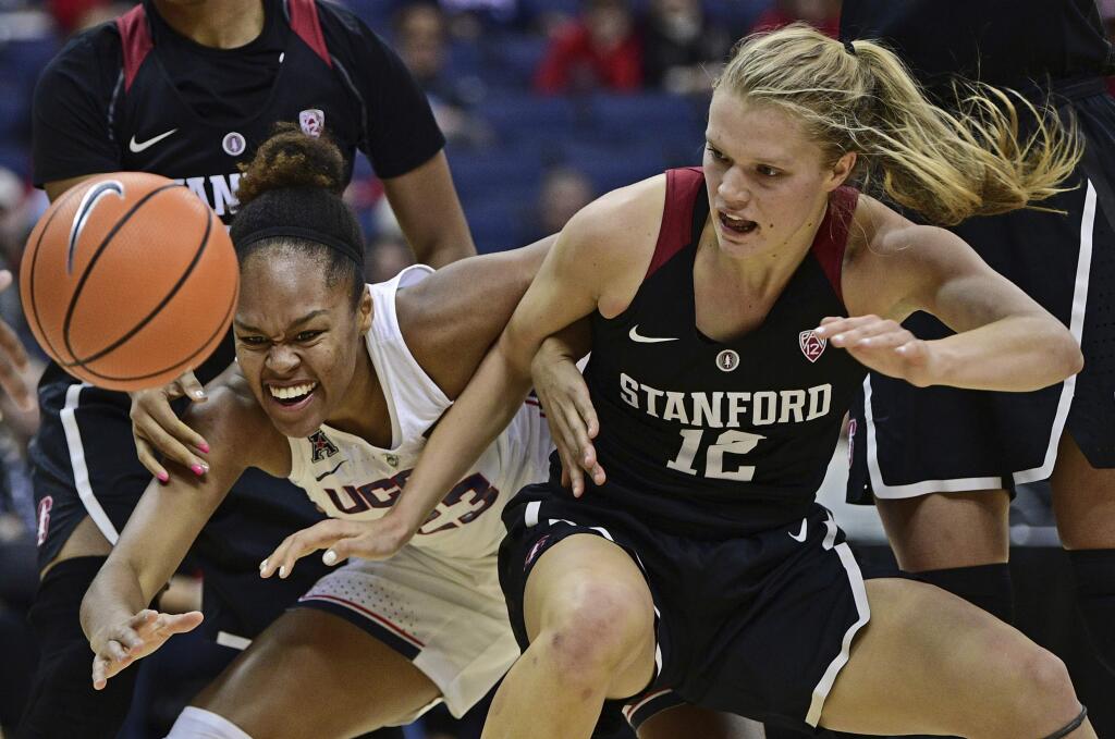 Connecticut's Kiana Williams, left, and Stanford's Brittany McPhee fight for a loose ball during the second quarter Sunday, Nov. 12, 2017, in Columbus, Ohio. (AP Photo/David Dermer)