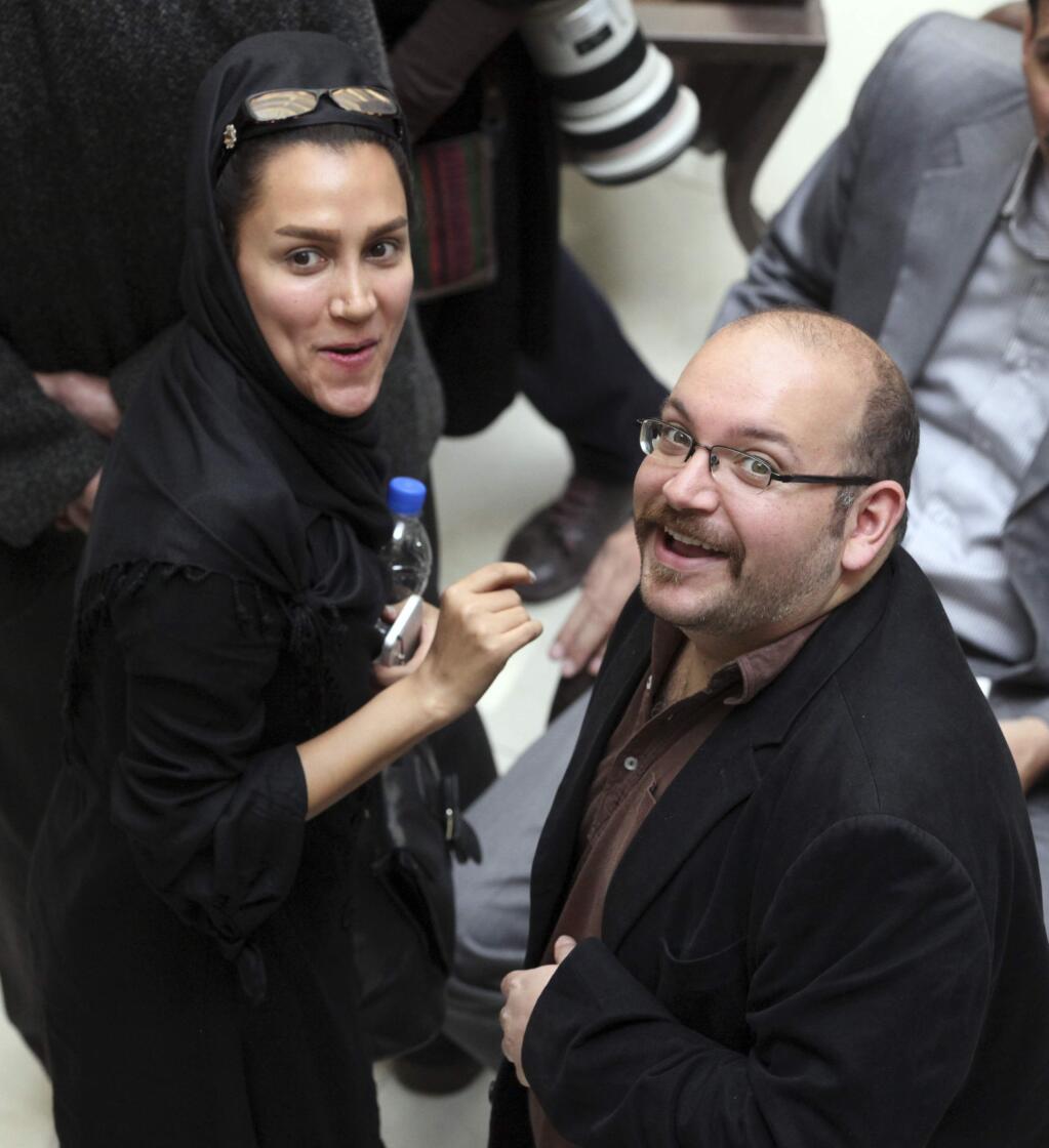 Jason Rezaian, an Iranian-American correspondent for the Washington Post, and his wife, Yeganeh Salehi, an Iranian correspondent for the Abu Dhabi-based daily newspaper, the National. Rezaian is charged with espionage and a trial began behind closed doors last week in Tehran. (VAHID SALEMI / Associated Press)