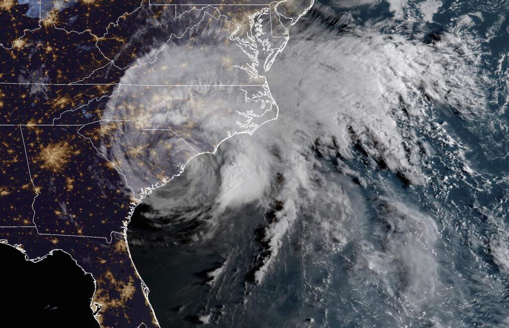 This satellite image provided by NOAA shows Hurricane Florence on the eastern coast of the United States early Saturday, Sept. 15, 2018. (NOAA via AP)