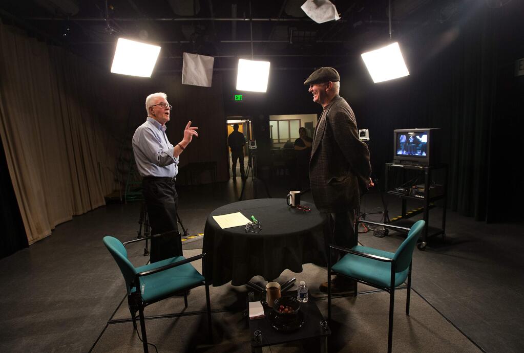 Host John Moran, left, explains to guest John Crowley how the interview show '707' will be videotaped on Friday at the CMedia center in Santa Rosa. (John Burgess/The Press Democrat)