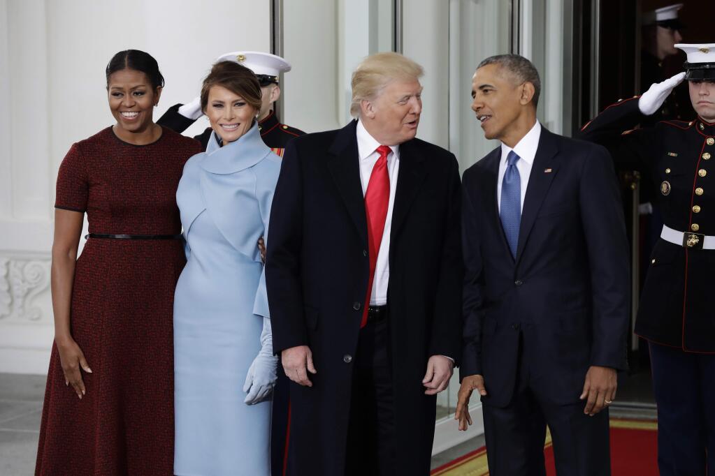 FILE - In a Friday, Jan. 20, 2017 file photo, President Barack Obama and first lady Michelle Obama pose with President-elect Donald Trump and his wife Melania at the White House in Washington. Before he left office in January, President Barack Obama offered his successor accolades and advice in a private letter that underscored some of his concerns as he passed the baton. In the letter, published Sunday, Sept. 3, 2017, by CNN, Obama urged President Donald Trump to “build more ladders of success for every child and family,” to “sustain the international order” and to protect “democratic institutions and traditions.”(AP Photo/Evan Vucci, File)