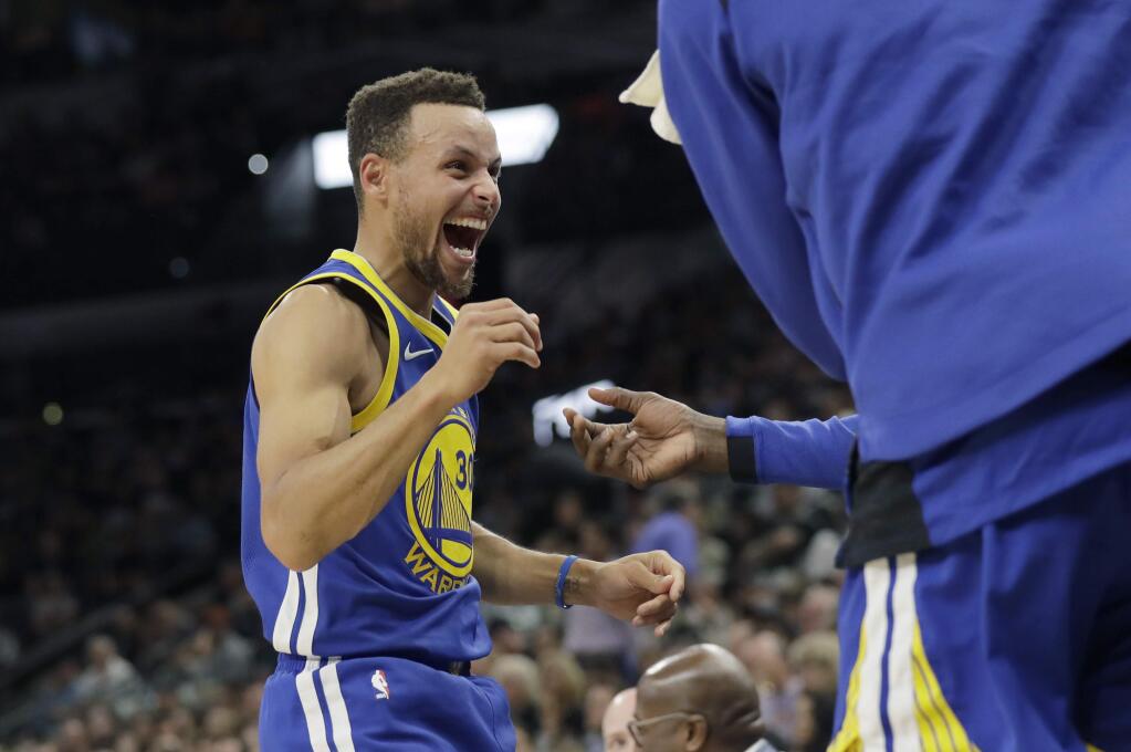 Golden State Warriors guard Stephen Curry (30) celebrates with his team during the second half of an NBA basketball game against the San Antonio Spurs, Thursday, Nov. 2, 2017, in San Antonio. (AP Photo/Eric Gay)