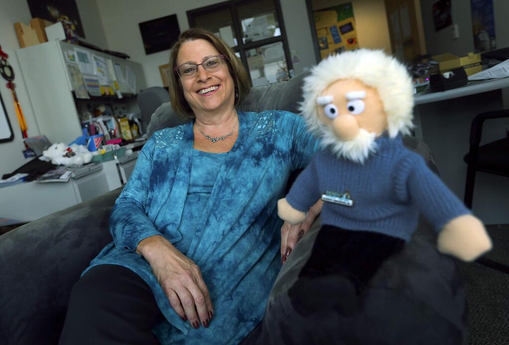 JOHN BURGESS / The Press Democrat)Dr. Lynn Cominsky, head of the SSU Physics and Astronomy department, shares her office with her friend, Albert Einstein.