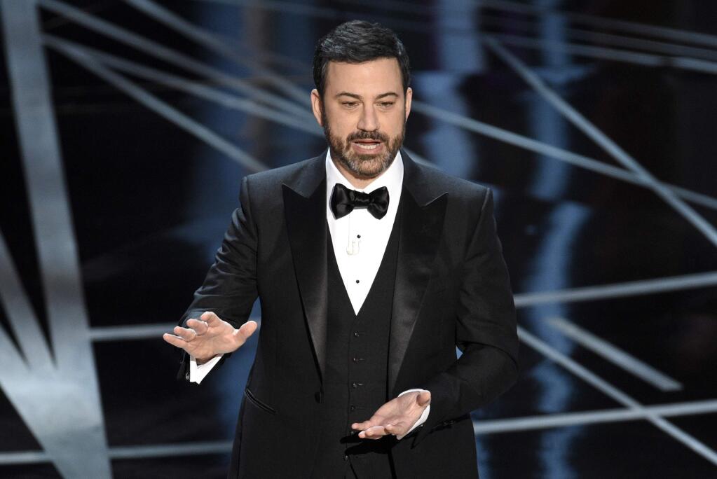 FILE - In this Feb. 26, 2017, file photo, host Jimmy Kimmel appears at the Oscars in Los Angeles. Kimmel accepted U.S. Senate candidate Roy Moore's invitation to meet him in Alabama on Nov. 30, 2017, after Kimmel sent a comedian to heckle Moore during a talk he was giving at a church the night before. (Photo by Chris Pizzello/Invision/AP, File)