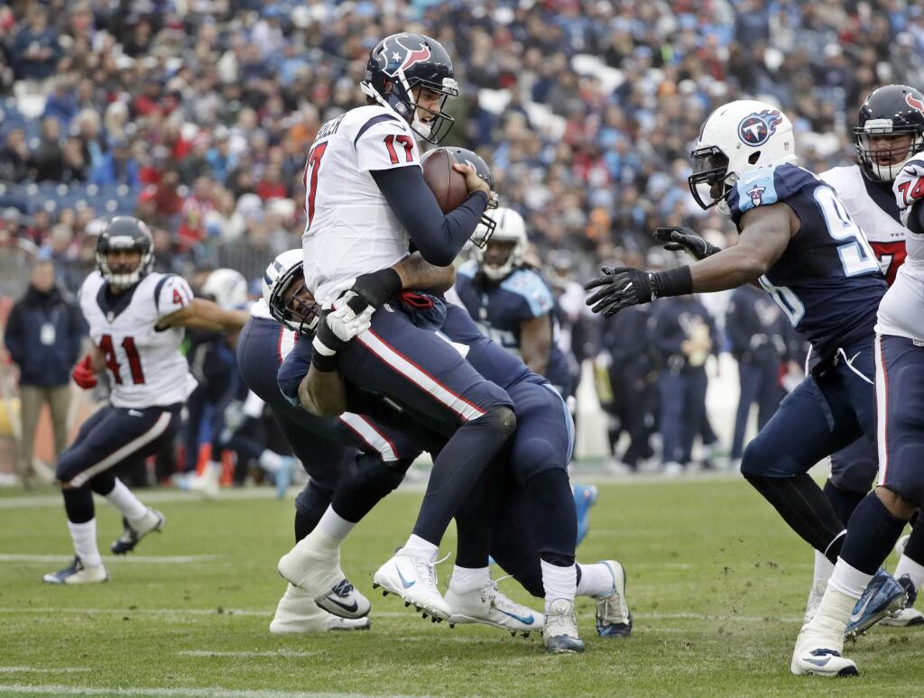 Houston Texans quarterback Brock Osweiler (17) is sacked by Tennessee Titans defensive tackle Jurrell Casey for an 8-yard loss in the first half of an NFL football game Sunday, Jan. 1, 2017, in Nashville, Tenn. (AP Photo/James Kenney)