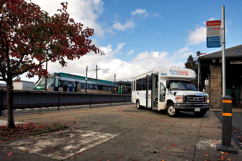 A ParkSMART shuttle waits for passengers at Railroad Square in Santa Rosa, California, on Wednesday, November 28, 2018. (Alvin Jornada / The Press Democrat)