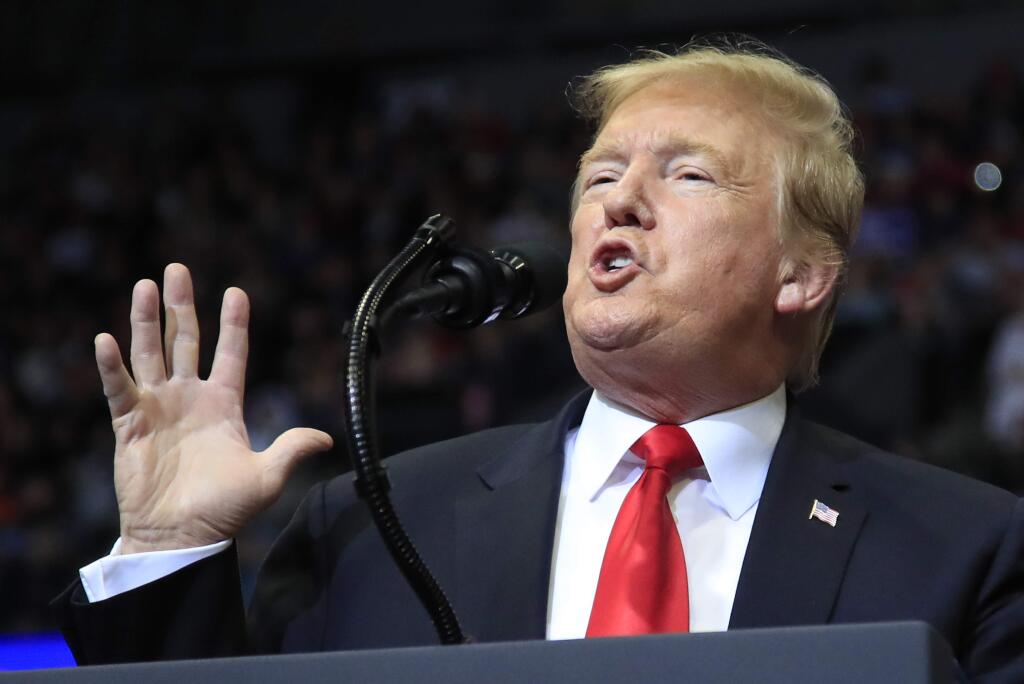 In this March 28, 2019 photo, President Donald Trump speaks at a campaign rally in Grand Rapids, Mich. Trump is suggesting he will defer until after 2020 his push for a Republican health care plan to replace the Affordable Care Act. Trump tweeted late Monday that Congress will vote on a GOP plan after the elections, ”when Republicans hold the Senate & win back the House.” (AP Photo/Manuel Balce Ceneta)