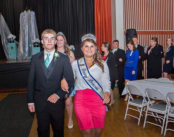 Miss Connie Jones District 3 Dairy Princess 2015-2016 with Robby Tunzi lead the contestants and escorts into the hall at the 59th Annual Dairy Princess Ball at the Veterans Memorial Building in Petaluma on Saturday, April 9, 2016. (JOHN O'HARA/FOR THE ARGUS-COURIER)
