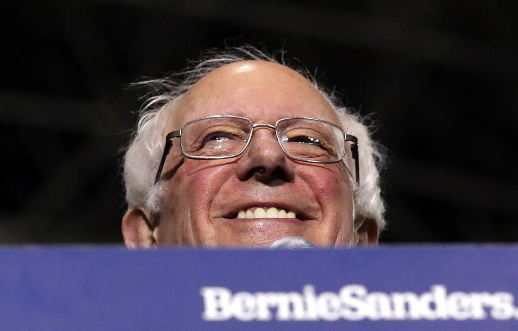 FILE - In this March 3, 2019 file photo, Sen. Bernie Sanders, I-Vt., smiles as he kicks off his 2020 presidential campaign at Navy Pier in Chicago. By the time California's presidential primary finally arrived in 2016, Sanders was a beaten man. This time around, everything has changed. Sanders arrives in California this week for rallies in San Diego, Los Angeles and San Francisco with the state's vast trove of delegates in play for 2020, no front-runner in a crowded Democratic presidential field and a left-leaning electorate looking favorably on his signature proposals. (AP Photo/Nam Y. Huh, File)