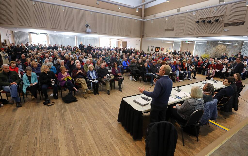 Chris Godley, director of Sonoma County's Department of Emergency Management, addresses the crowd during an Oakmont community meeting about the temporary homeless encampment that is being built at the nearby Los Guilicos campus, at the Berger Center in Santa Rosa on Friday, January 17, 2020.(Christopher Chung/ The Press Democrat)