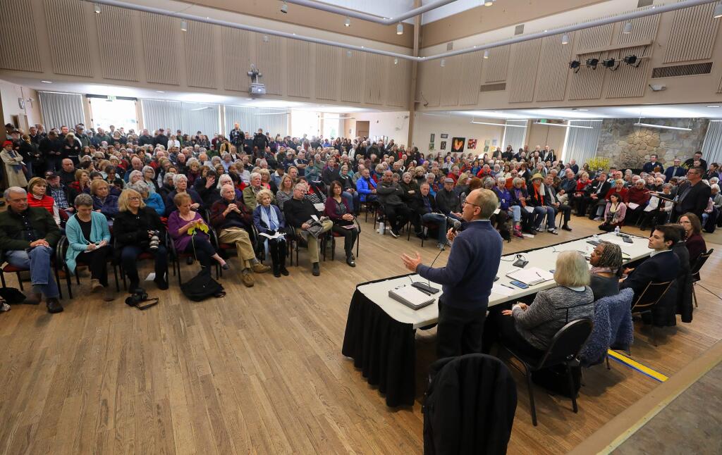 Chris Godley, director of Sonoma County's Department of Emergency Management, addresses the crowd during an Oakmont community meeting about the temporary homeless encampment that is being built at the nearby Los Guilicos campus, at the Berger Center in Santa Rosa on Friday, January 17, 2020.(Christopher Chung/ The Press Democrat)