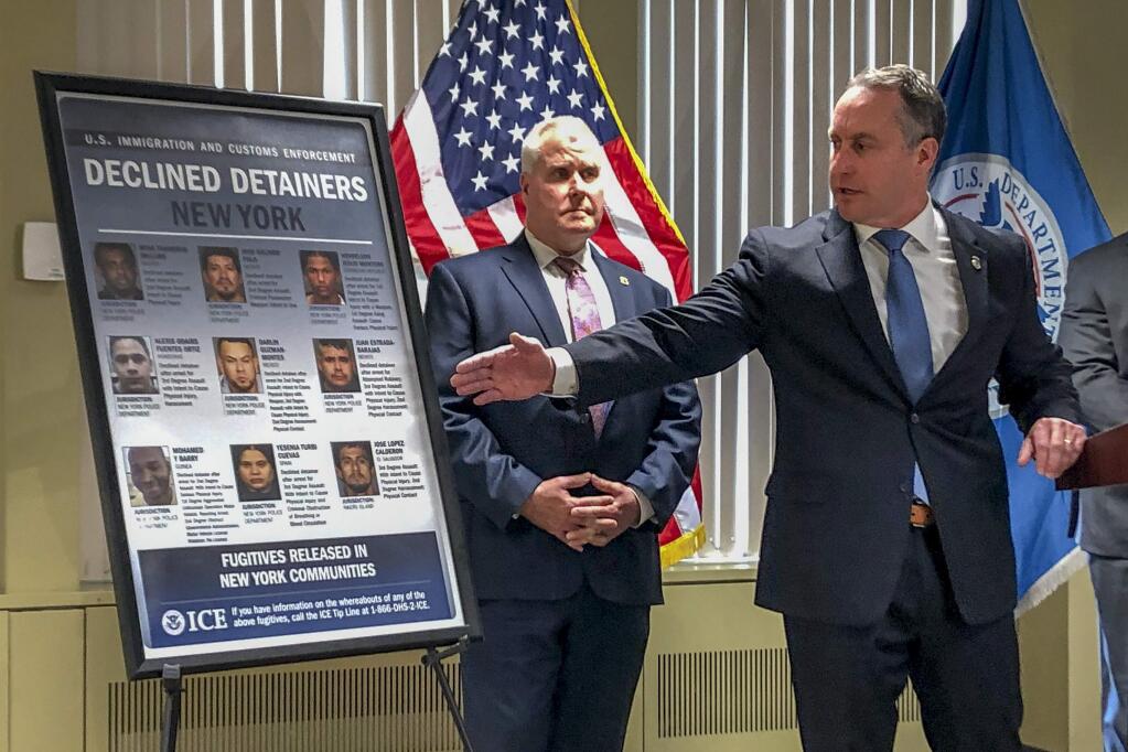 Matthew Albence, right, the acting director of U.S. Immigration and Customs Enforcement, speaks during a news conference, Friday, Jan. 17, 2020, in New York. The country's top immigration official blamed the 'sanctuary policies' of New York City on Friday for the sexual assault and killing of a 92-year-old woman, while the mayor's office decried such rhetoric as 'fear, hate and attempts to divide.' (AP Photo/Jim Mustian)