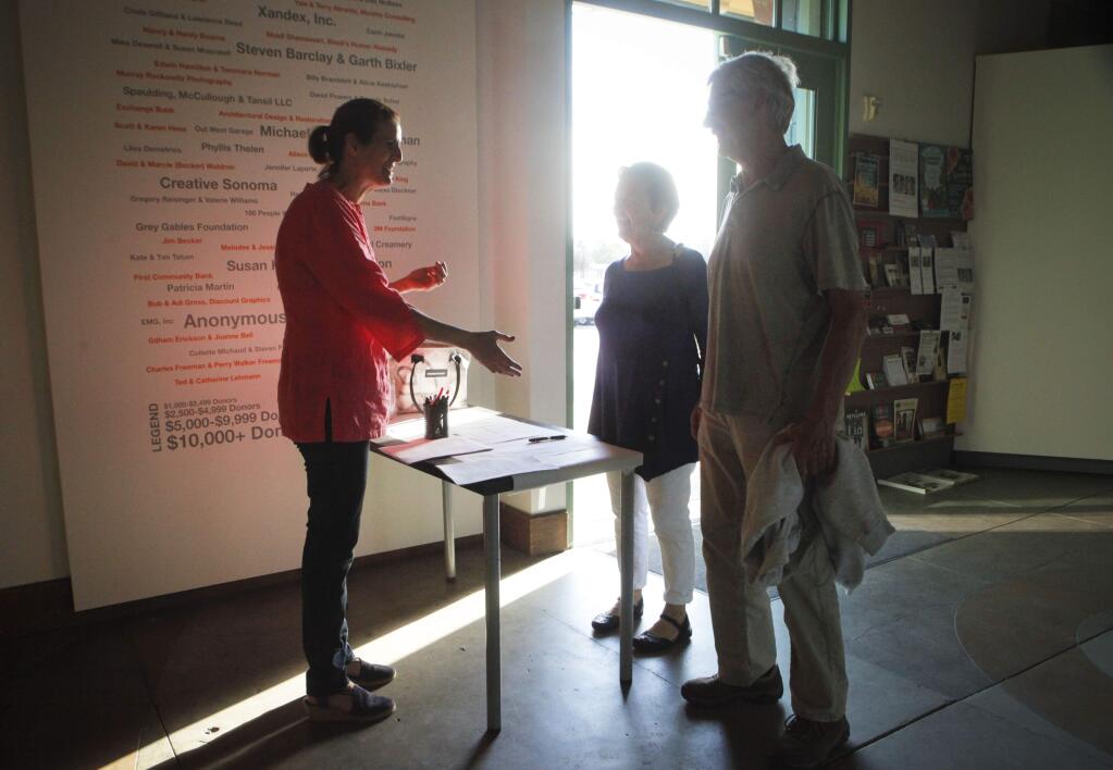 Llisa Demetrios, a Board member of the Petaluma Arts Center greeted guests who attended one of their 'town hall' meetings. (CRISSY PASCUAL/ARGUS-COURIER STAFF)