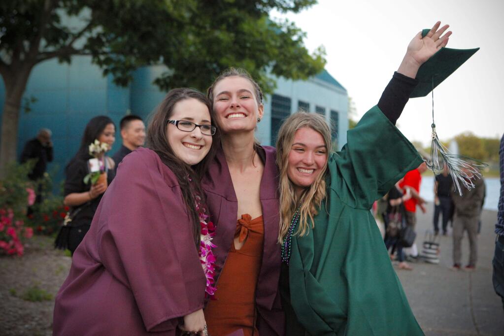 (Left to right)Erin Doherty of Valley Oaks HS, Julia Rose Sherman of Valley Oaks HS and Bleu Jones of Carpe Diem HS celebrate after receiving their diplomas last week.(CRISSY PASCUAL/ARGUS-COURIER STAFF)