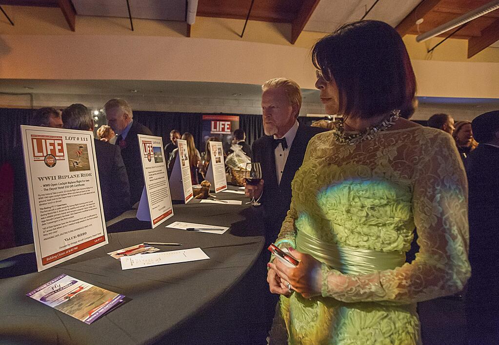 Tery and Dan Parks, looking over some of the silent auction items, were among the nearly 400 attendees at the Boys & Girls Clubs of Sonoma Valley annual fundraiser, the Sweethearts Gala, on Saturday, Feb 7. (Photos by Robbi Pengelly/Index-Tribune)