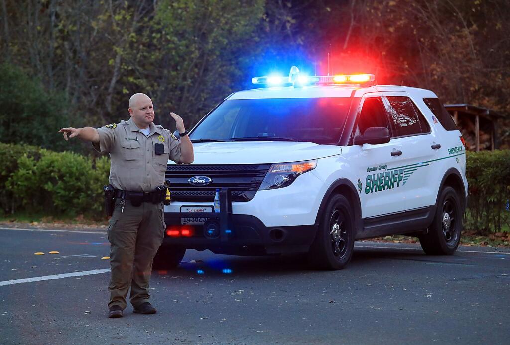 Sonoma County sheriff's deputies closed off Melita Road in response to a Kenwood area shooting on Friday, Dec. 2, 2016. (JOHN BURGESS/ PD)