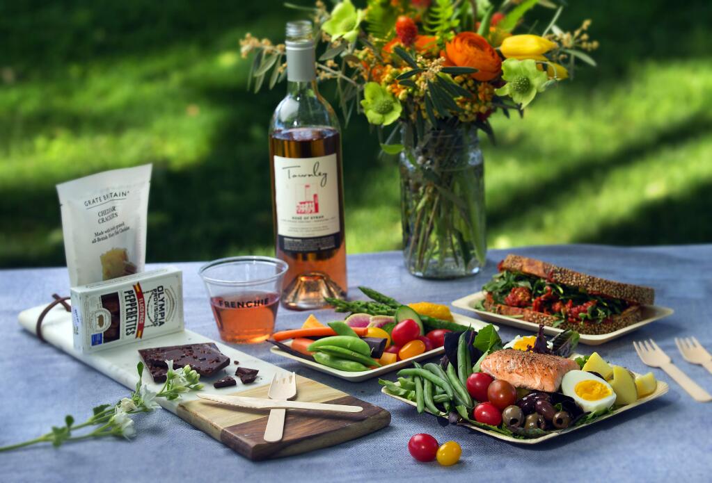 Celebrate Bastille Day with a Salmon Salade Nicoise Salad, at lower right, made with  haricots verts, potatoes, hard-cooked eggs, tomato and olives on a bed of greens. (John Burgess/Press Democrat)