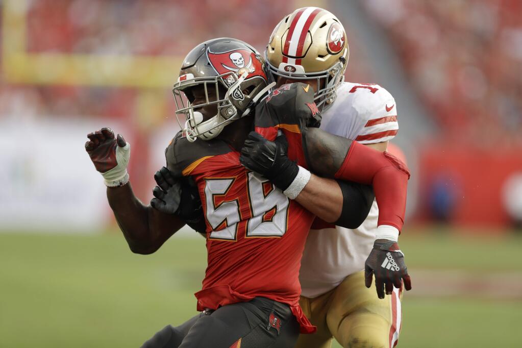 Tampa Bay Buccaneers linebacker Shaquil Barrett (58) and San Francisco 49ers offensive tackle Joe Staley (74) work during the second half, Sunday, Sept. 8, 2019, in Tampa, Fla. (AP Photo/Chris O'Meara)