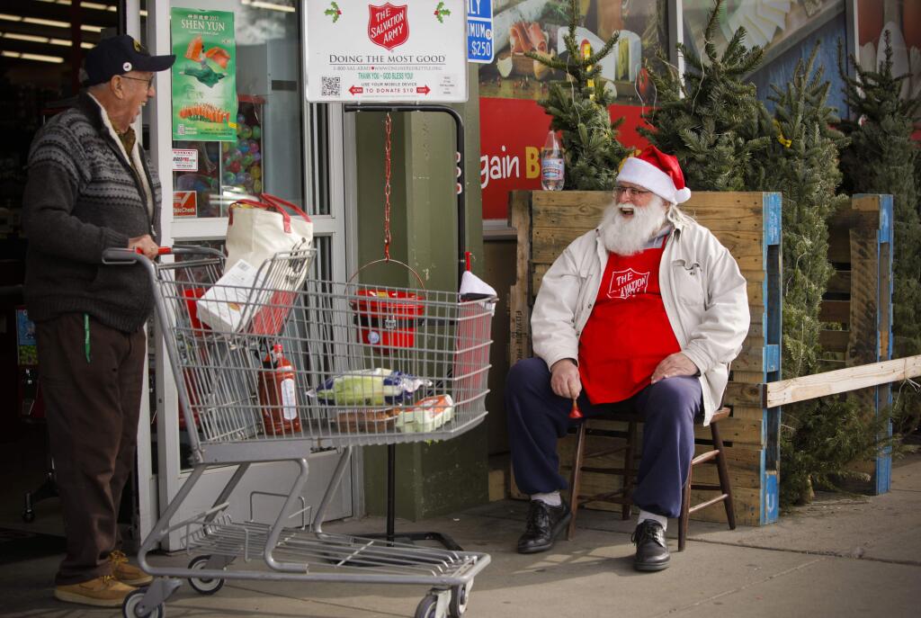 Petaluma, CA, USA. Monday, December 05, 2016._ David Burke, 72, a volunteer for the Salvation Army Red Kettle campaign, rings his bell outside the Grocery Outlet in Petaluma. (CRISSY PASCUAL/ARGUS-COURIER STAFF)
