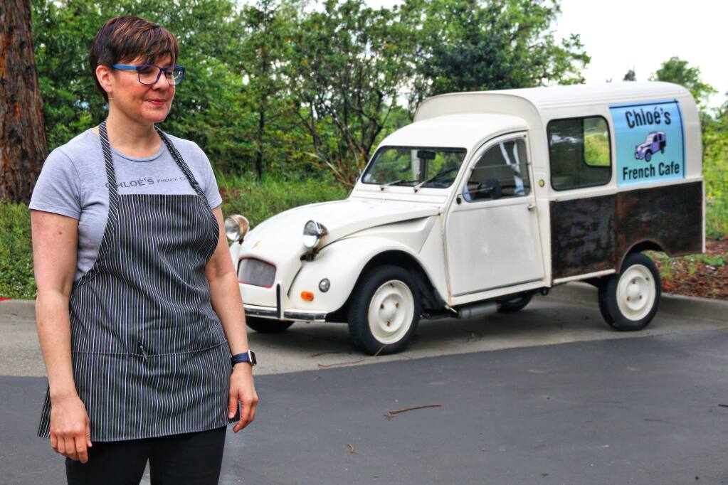 Chloe's French Cafe co-owner Renee Pisan and the display French delivery truck in front of Santa Rosa retaurant and catering kitchen on April 25, 2017. The company has two operating delivery vans and is planning on a third. (JEFF QUACKENBUSH / NORTH BAY BUSINESS JOURNAL)