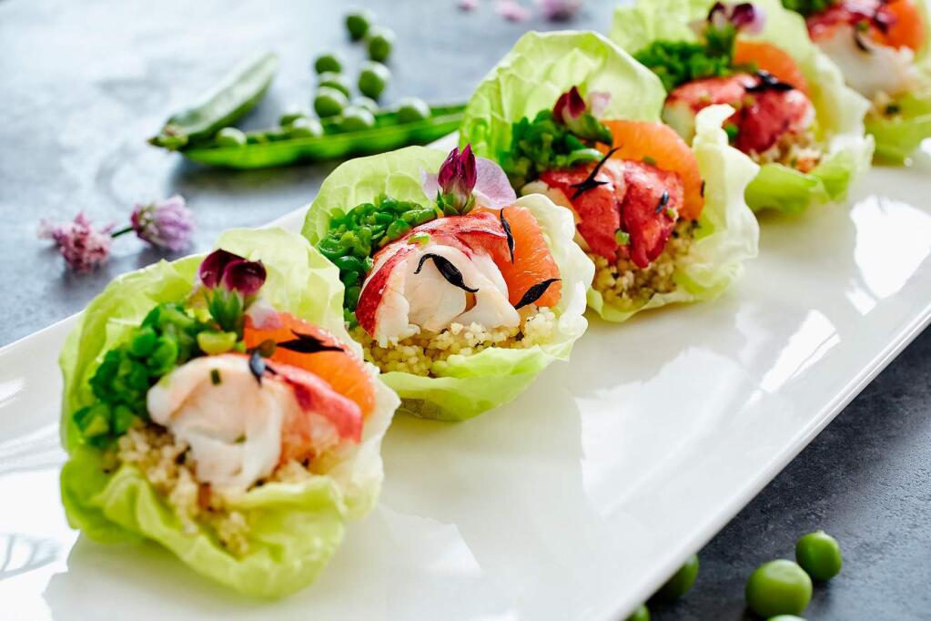Close up of fresh seafood salad in lettuce cups